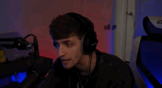 Man Sitting in Front of Microphone