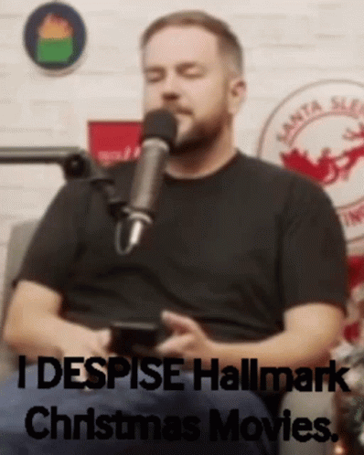 Man Sitting in Front of Microphone Saying I Despise Hallmark Christmas Movies
