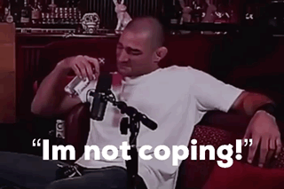 Man Sitting in Front of Microphone Saying Im Not Coping
