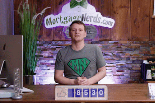 Man Sitting in Front of Mortgage Nerds Sign