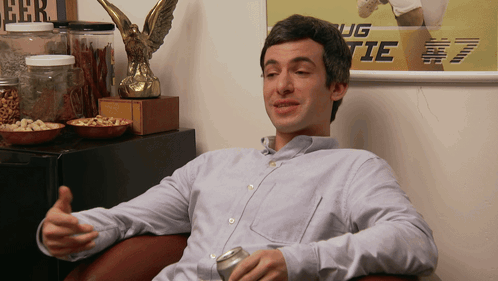 Man Sitting in Front of Ug Tie Poster