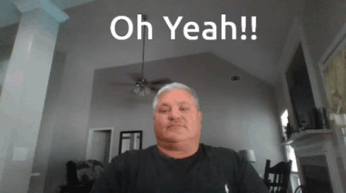Man Sitting In Living Room Saying Oh Yeah GIF