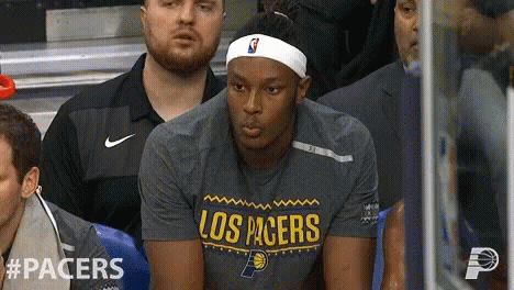 Man Sitting in Los Pacers Shirt at Stadium