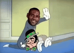 Man Sitting Next To Cartoon Character With Green Hat GIF