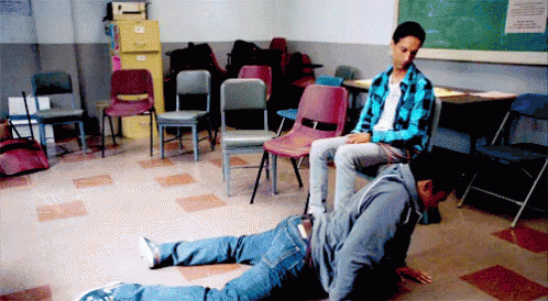 Man Sitting on Another Man's Back