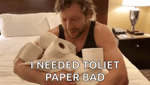 Man Sitting on Bed Holding Toilet Paper Saying I Needed Toilet Paper Bad