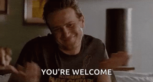Man Sitting On Bed Saying Youre Welcome GIF