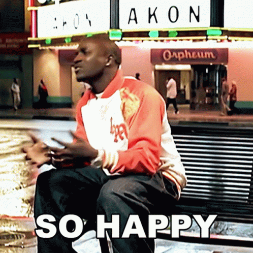 Man Sitting On Bench In Front Of Akon Orpheum GIF