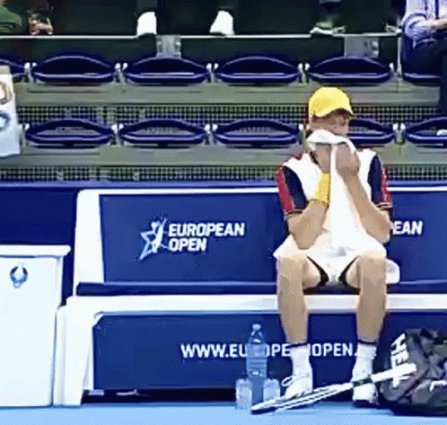 Man Sitting On Bench With European Open GIF