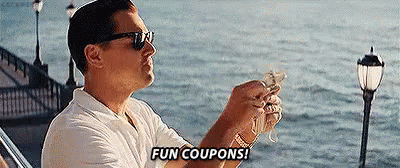 Man Sitting On Boat Holding Money Saying Fun Coupons GIF