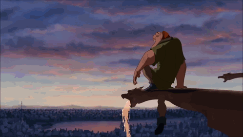 Man Sitting On Cliff Edge With Sunset GIF