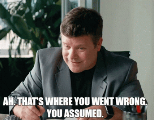 Man Sitting On Couch Hands Behind Head Says That's A Big Assumption Netflix GIF