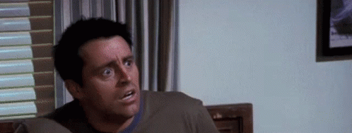 Man Sitting On Couch Making Funny Face GIF