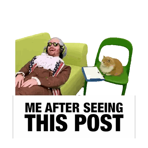 Man Sitting on Couch Next to Cat