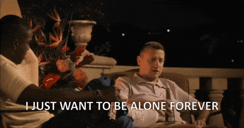 Man Sitting on Couch Saying I Just Want to Be Alone Forever