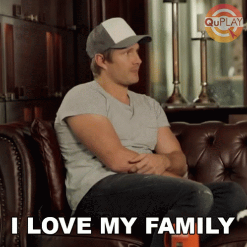Man Sitting On Couch Saying I Love My Family GIF