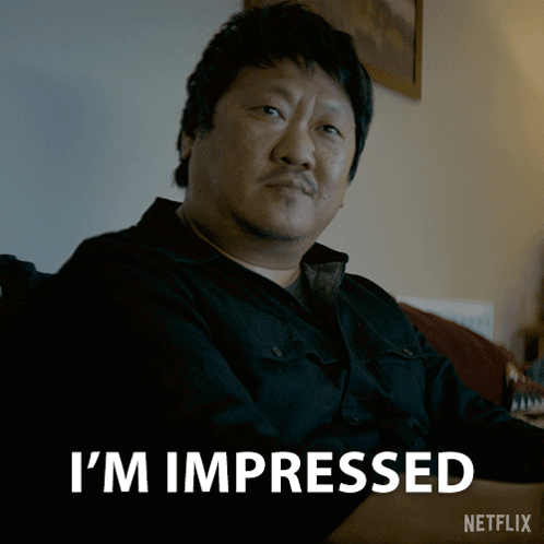 Man Sitting on Couch Saying I'm Impressed