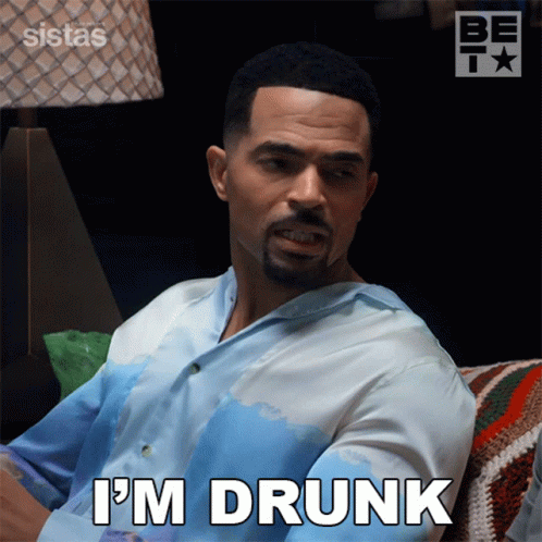 Man Sitting on Couch Saying Im Drunk