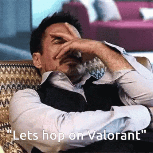 Man Sitting on Couch Saying Lets Hop on Valorant