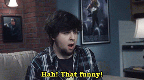 Man Sitting on Couch Says Hah That Funny