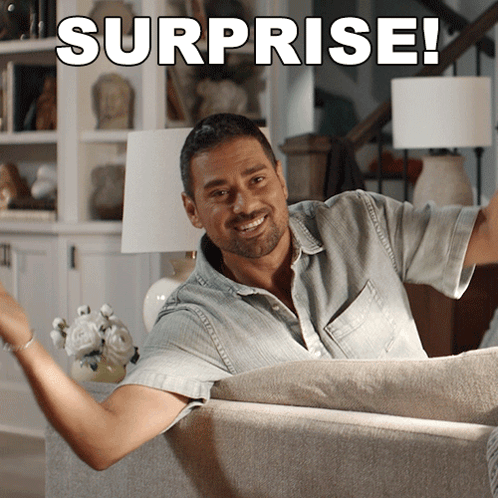 Man Sitting on Couch Surprised