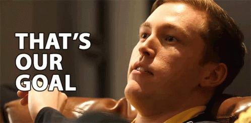 Man Sitting On Couch With Goal Text GIF
