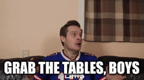 Man Sitting On Couch With Grab The Tables Boys GIF