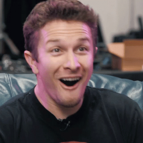 Man Sitting On Couch With Mouth Open GIF
