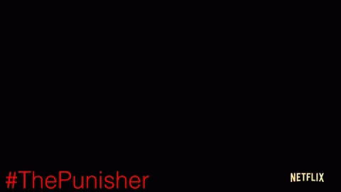 Man Sitting on Couch with Netflix Logo