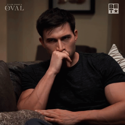 Man Sitting on Couch with Tyler Perry's Oval