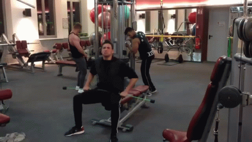 Man Sitting on Gym Bench in I Love You Shirt