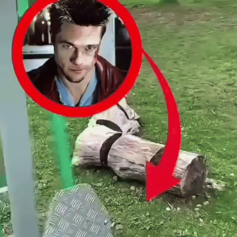 Man Sitting on Log With Red Arrow