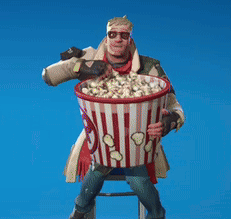 Man Sitting on Stool Holding Popcorn Bucket