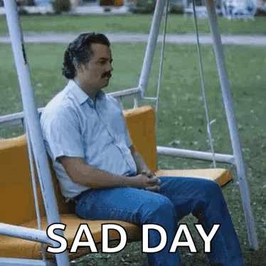 Man Sitting on Swing Saying Sad Day