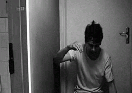 Man Sitting on Toilet