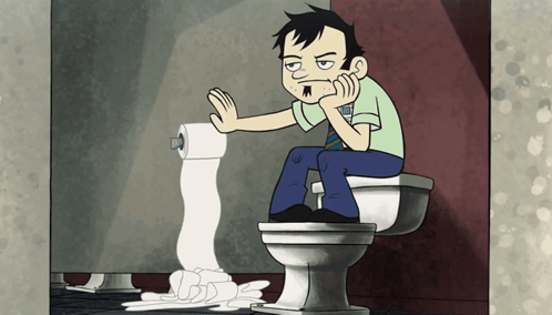 Man Sitting on Toilet Holding Toilet Paper