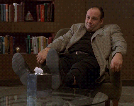 Man Sitting With Feet Up Next To Tissue Box GIF