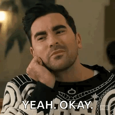 Man Sitting With Hand On Chin Saying Yeah Okay GIF