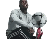 Man Sitting With Soccer Ball