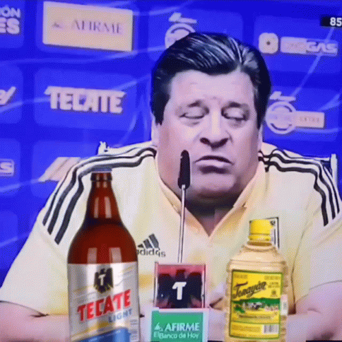 Man Sitting with Tecate Light