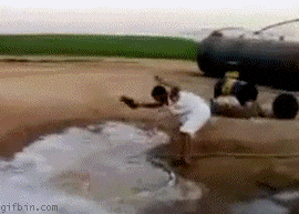 Man Slap Fire Hose Using Slippers GIF