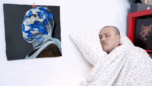 Man Sleeping Before Painting of Man's Head