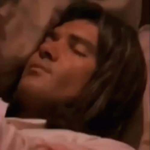 Man Sleeping in Bed