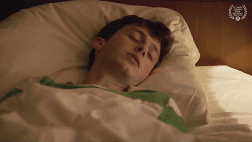 Man Sleeping In Bed With Atlanta Film Festival Laurel GIF