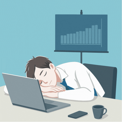 Man Sleeping on Desk in Front of Laptop