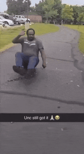 Man Sliding Down Road Saying Unc Still Got It GIF