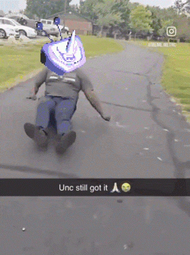 Man Sliding Down Road Saying UNC Still Got It GIF