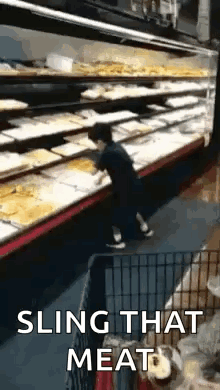 Man Slinging Meat Dog Watches in Grocery Store