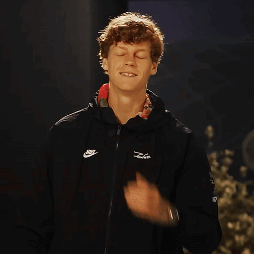 Man Smiling Adjusting Black Nike Jacket GIF
