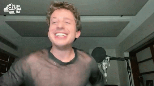 Man Smiling at Microphone 95-106 Capital FM